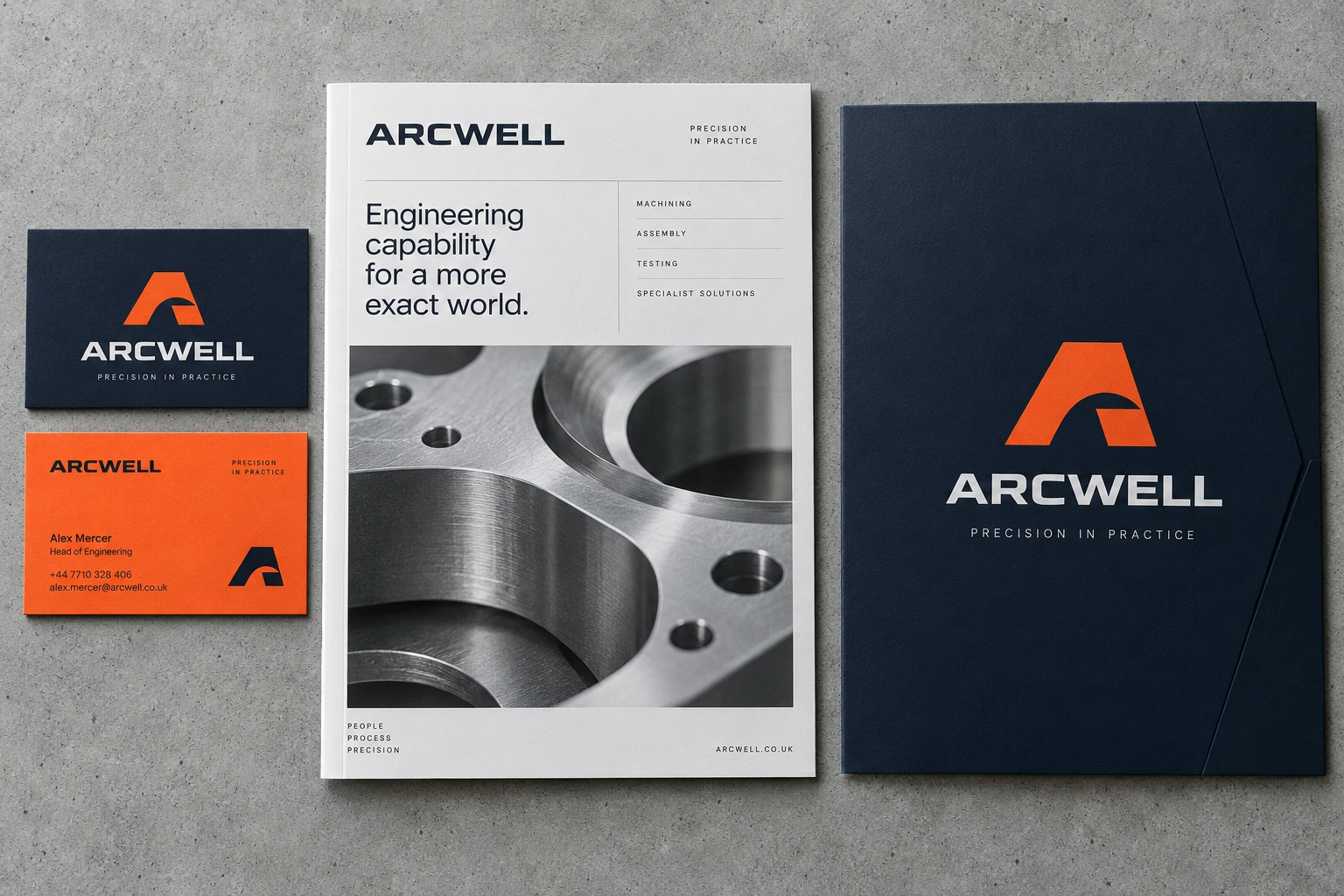 Arcwell engineering brochure, navy presentation folder and orange business cards