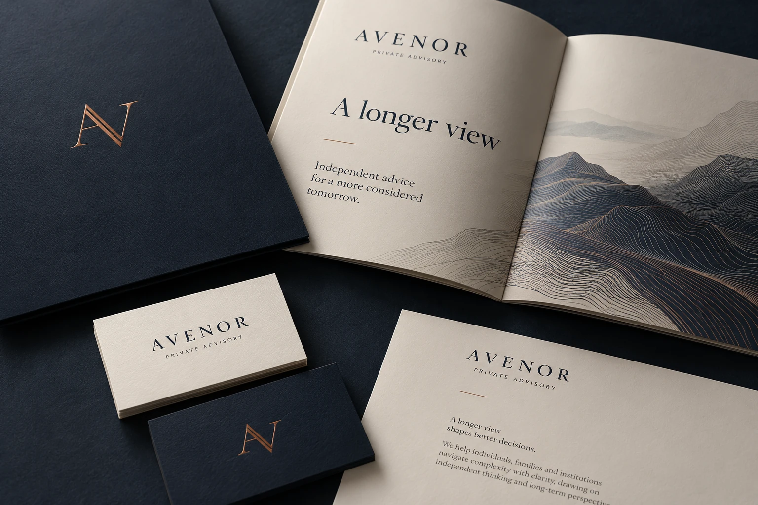 Avenor navy and ivory advisory identity with copper monogram, open brochure and business cards