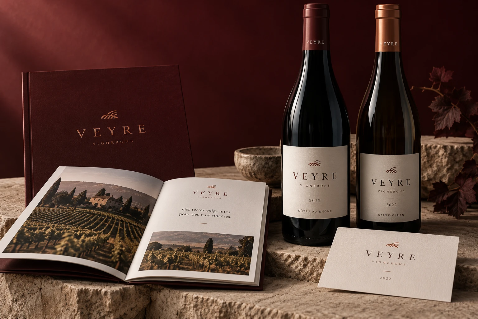 Veyre burgundy wine identity with two bottles, vineyard brochure and limestone-coloured invitation